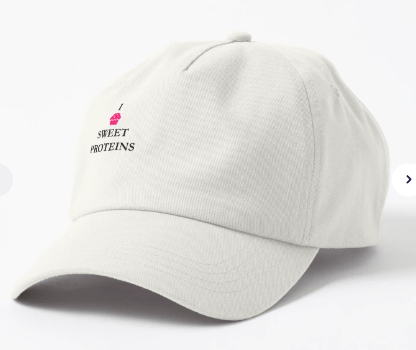 A beige baseball cap featuring the embroidered text 'I SWEET PROTEINS' with a small illustration of an ice cream cone.